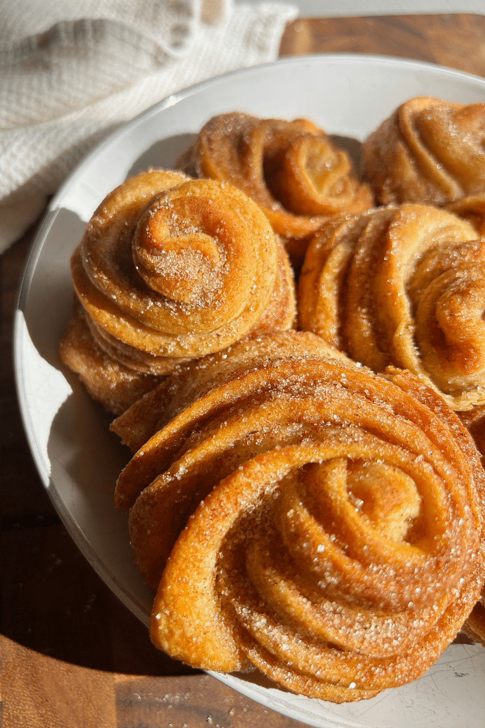 Cinnamon sugar cruffins made with crescent dough and baked in a muffin pan.